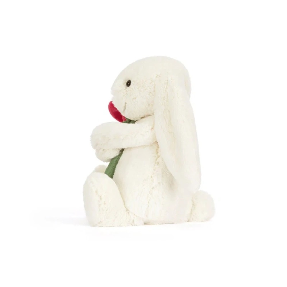 Jellycat – Wesoły króliczek z czerwoną różą kremowa przytulanka na Walentynki 31 cm 